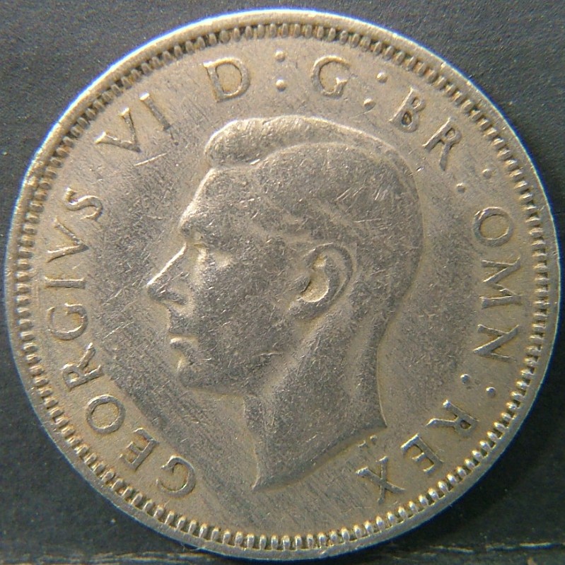 Back side of 🇬🇧 United Kingdom – Monarchs and Milestones 1 Shilling Scot 1947 coin