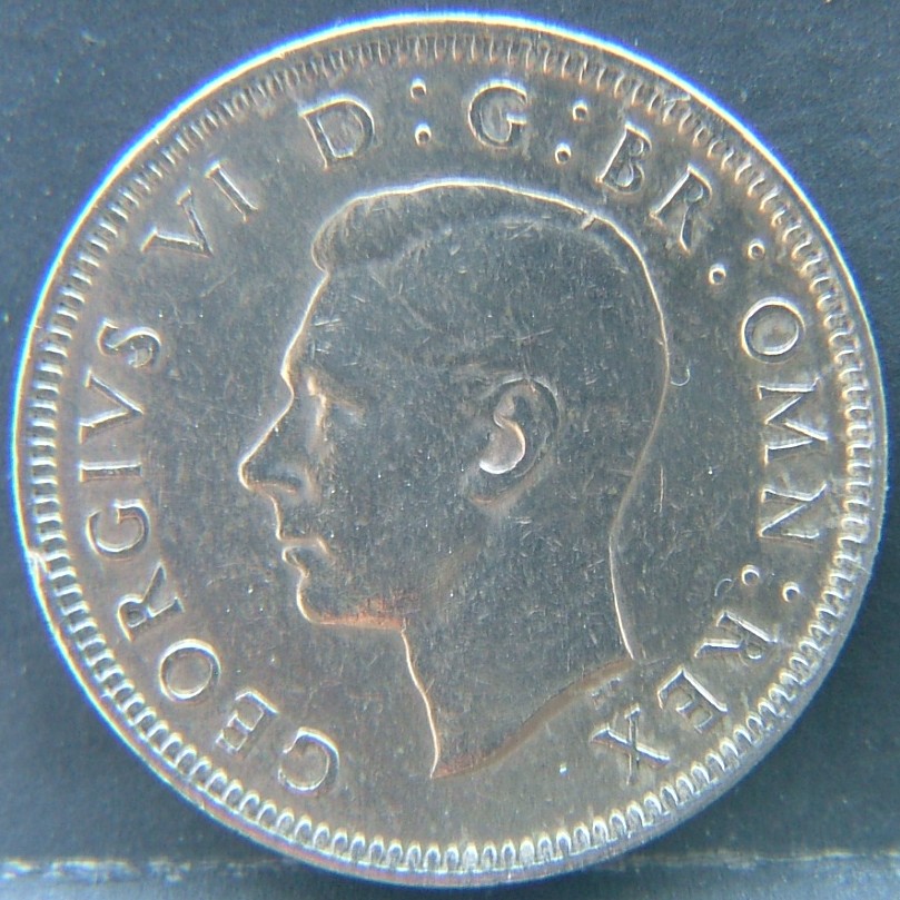 Back side of 🇬🇧 United Kingdom – Monarchs and Milestones 1 Shilling Scot 1949 coin